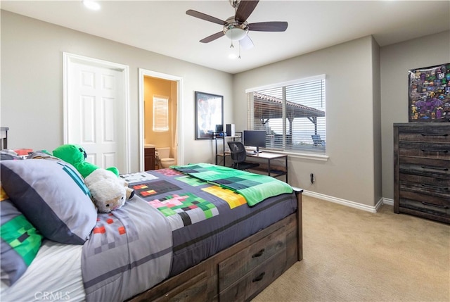 carpeted bedroom featuring ceiling fan and connected bathroom