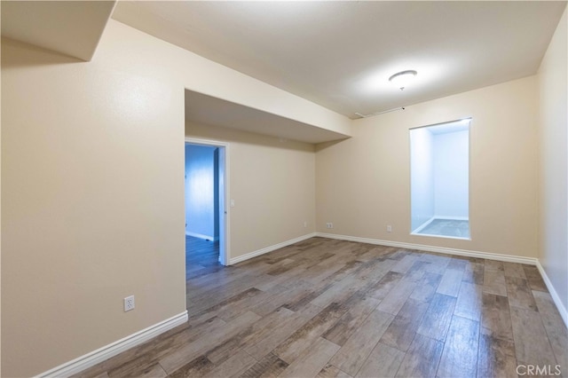 empty room featuring wood-type flooring