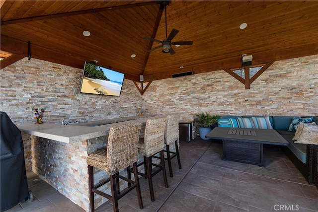 view of patio featuring an outdoor bar, a gazebo, ceiling fan, and an outdoor hangout area