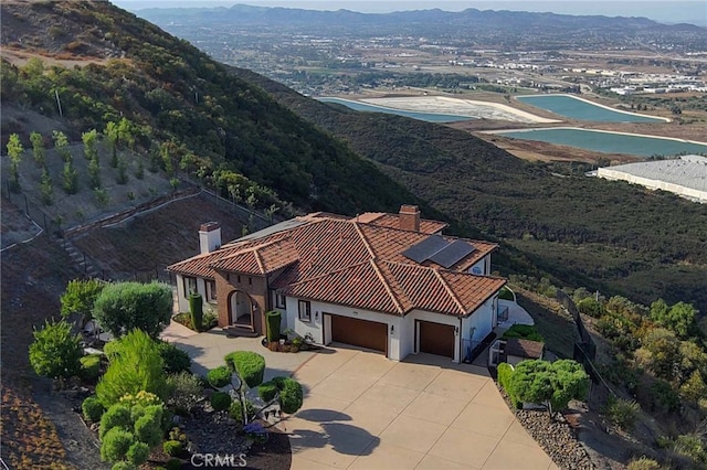 drone / aerial view featuring a mountain view