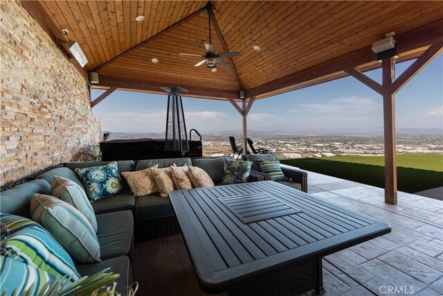 view of patio with outdoor lounge area, a gazebo, and ceiling fan