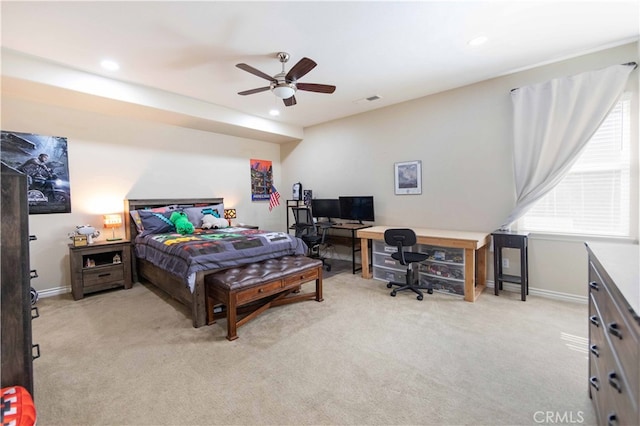 bedroom featuring light carpet and ceiling fan