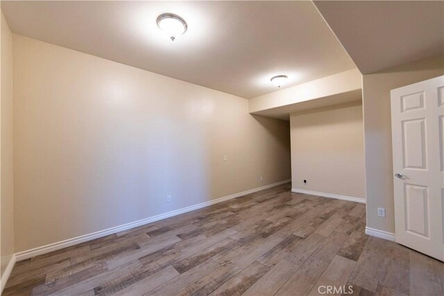 basement featuring light hardwood / wood-style floors