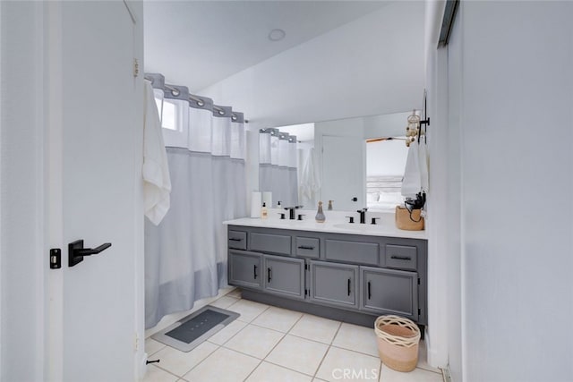 bathroom with vanity, a shower with shower curtain, and tile patterned floors