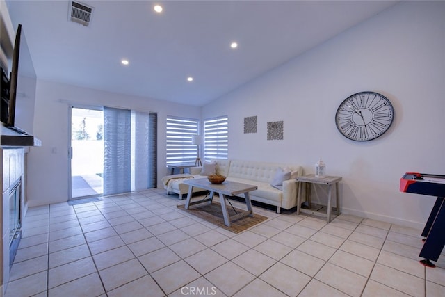 unfurnished living room featuring light tile patterned flooring and high vaulted ceiling