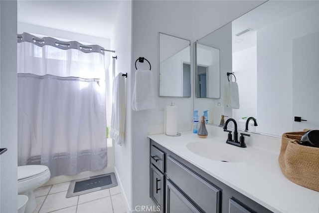 bathroom with walk in shower, tile patterned flooring, vanity, and toilet