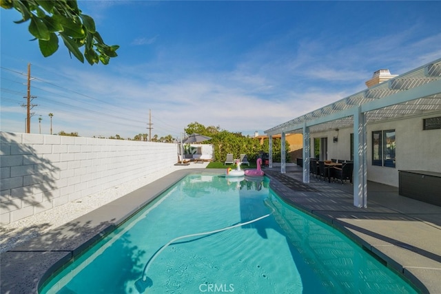 view of swimming pool with a patio area