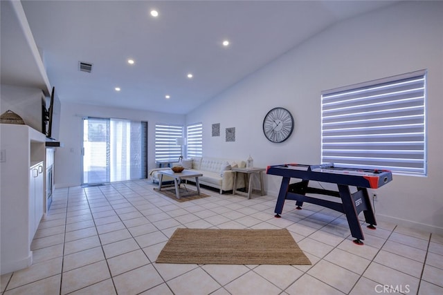 tiled living room with vaulted ceiling