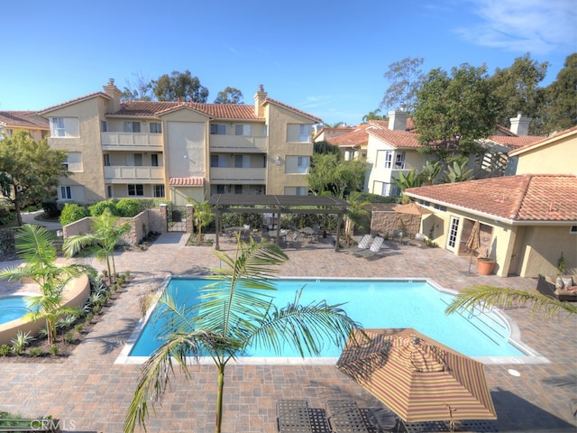 view of swimming pool featuring a patio area