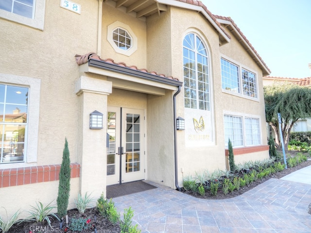 property entrance with a patio area