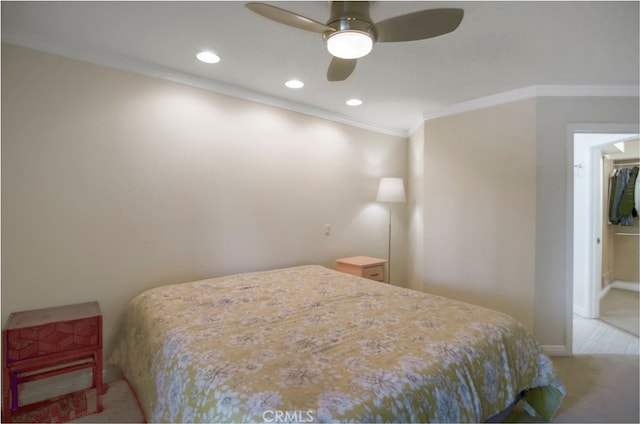 bedroom with light carpet, ceiling fan, and crown molding