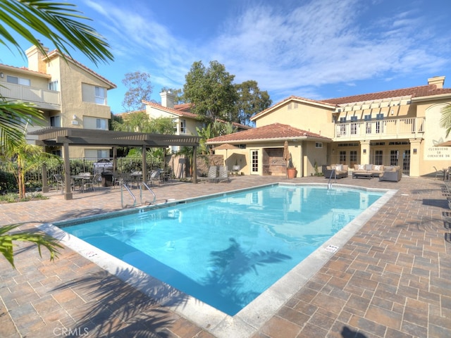 view of pool featuring a pergola and a patio area