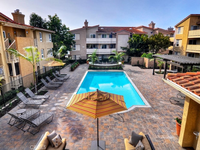 view of pool featuring a patio area