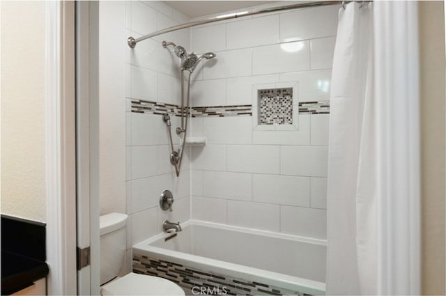 bathroom with shower / bathtub combination with curtain and toilet