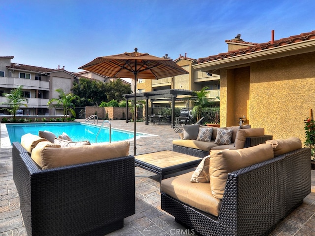 view of swimming pool featuring an outdoor living space and a patio area