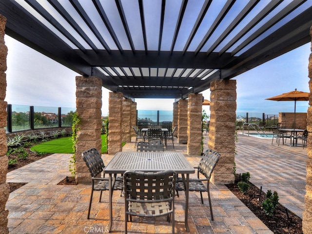 view of patio / terrace with a pergola and a community pool