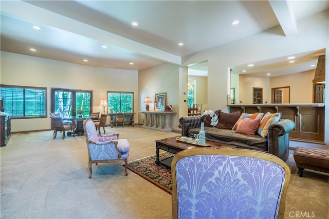 living room featuring light colored carpet and beamed ceiling