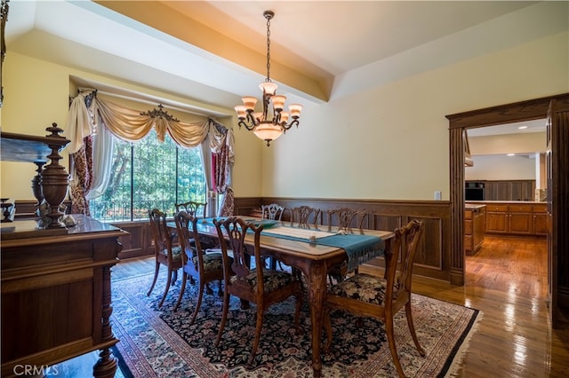 dining area featuring a chandelier and hardwood / wood-style floors