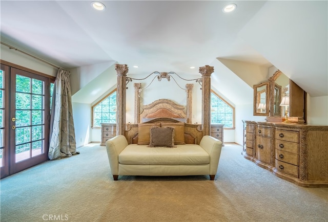 carpeted bedroom featuring french doors, lofted ceiling, and access to exterior