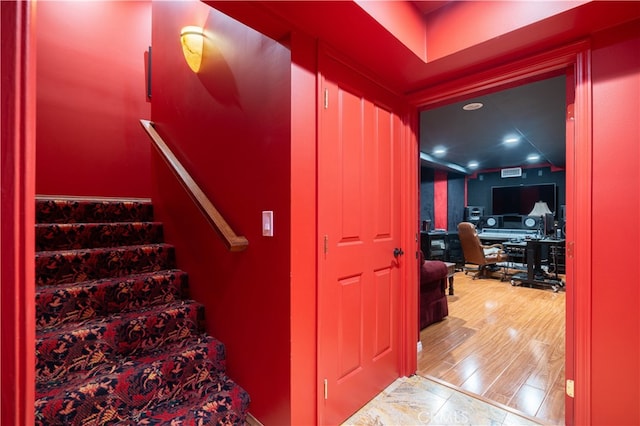 staircase featuring hardwood / wood-style floors