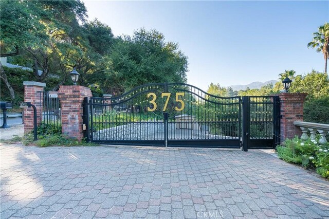 view of gate featuring a mountain view