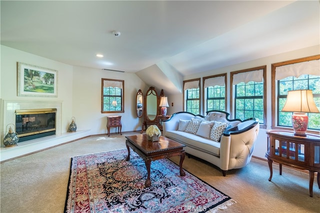 living room with carpet floors and lofted ceiling