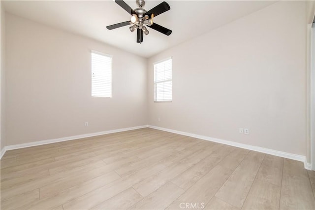 spare room with light hardwood / wood-style floors and ceiling fan