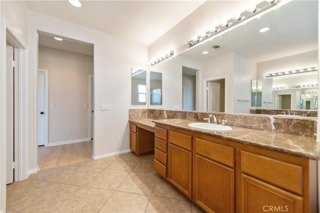 bathroom featuring tile patterned flooring and vanity