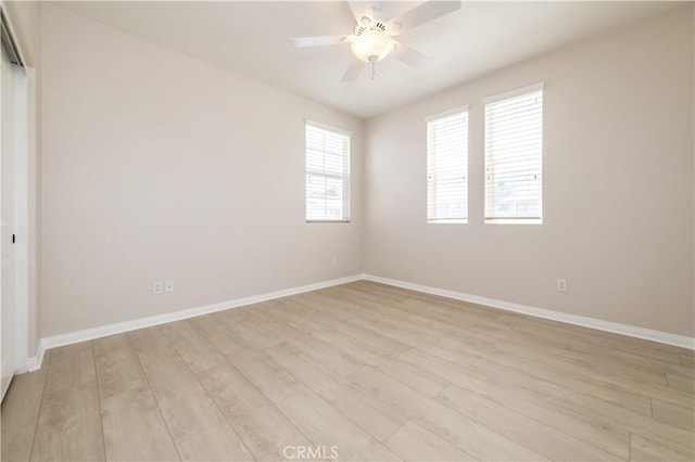 spare room with ceiling fan and light hardwood / wood-style floors