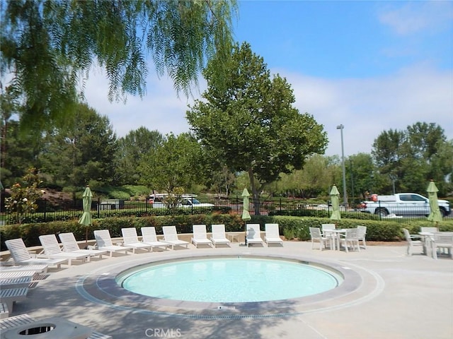 view of swimming pool with a patio