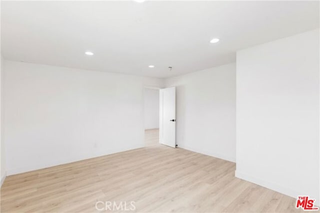 unfurnished room featuring light hardwood / wood-style floors