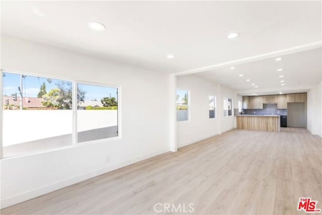 unfurnished living room with light wood-type flooring