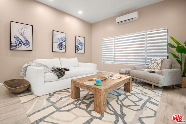 living room with wood-type flooring and a wall mounted AC