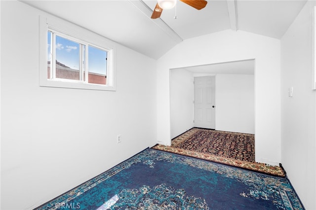 additional living space with vaulted ceiling with beams and ceiling fan