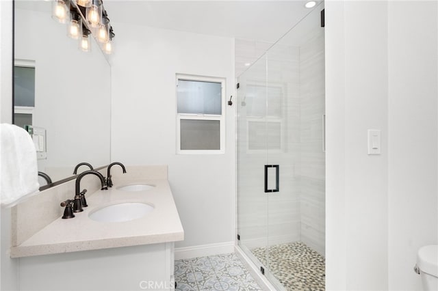 bathroom featuring toilet, vanity, tile patterned floors, and walk in shower