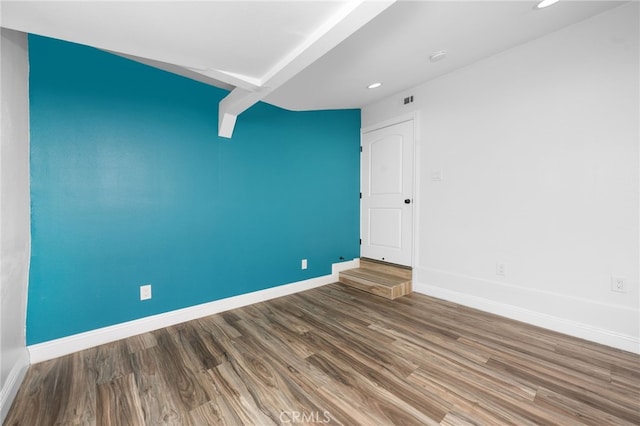 unfurnished room with hardwood / wood-style flooring