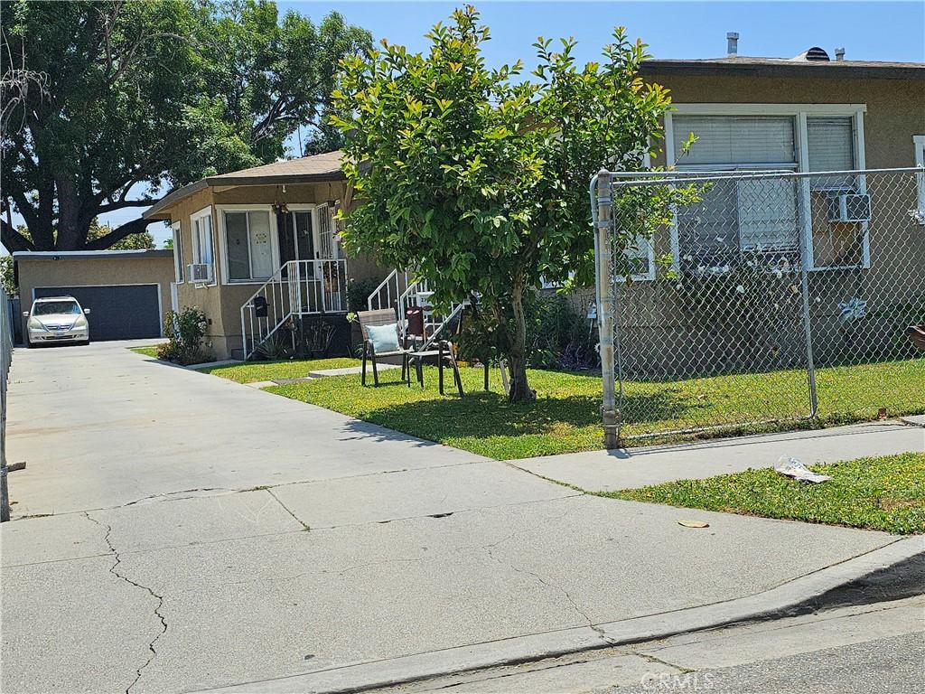 view of front of house with a front yard and a garage