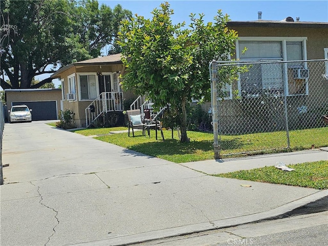 view of front of house with a front yard and a garage