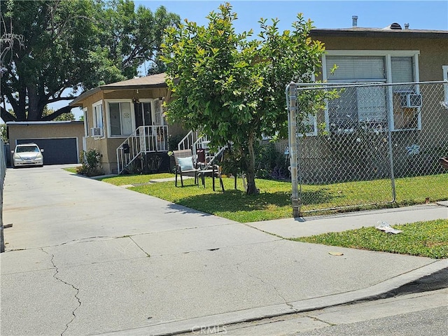 214 E Johnson St, Compton, CA 90220 - view of front facade featuring stucco siding and a detached garage