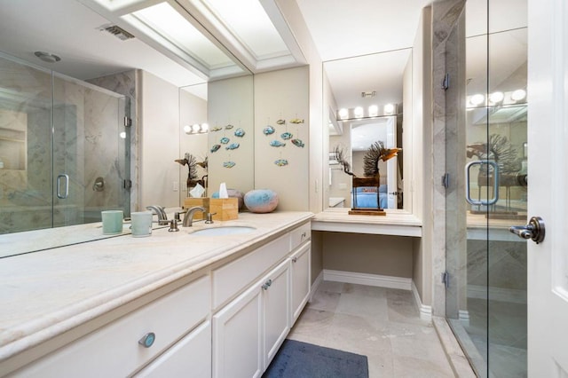 bathroom featuring walk in shower and vanity