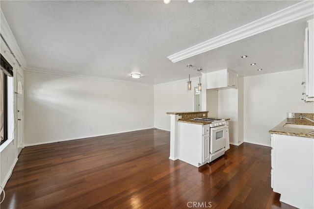 kitchen with white range with gas cooktop, crown molding, white cabinets, and dark hardwood / wood-style floors