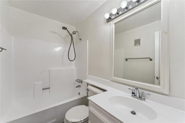 full bathroom with shower / tub combination, vanity, and toilet