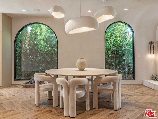 dining area with light parquet floors