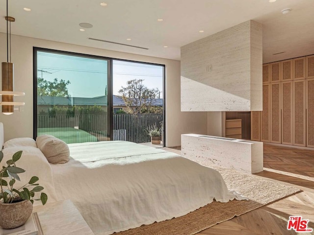 bedroom with access to outside and parquet floors