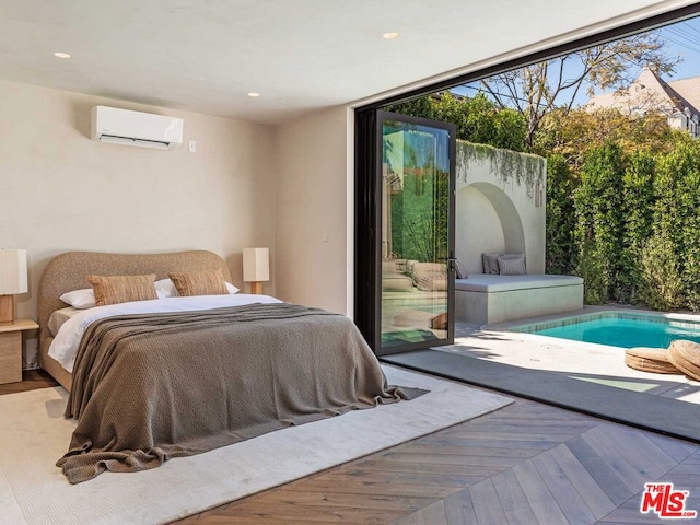 bedroom with access to outside, parquet floors, and a wall unit AC