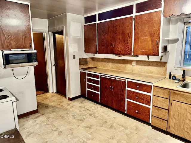 kitchen with electric range and sink