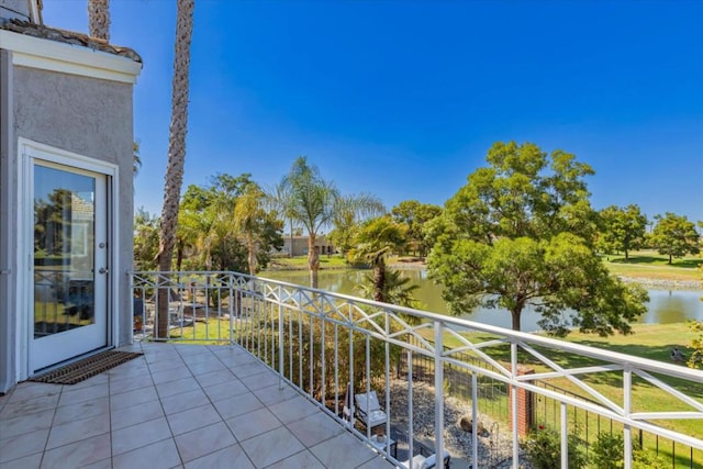 balcony featuring a water view