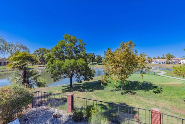 exterior space with a yard and a water view