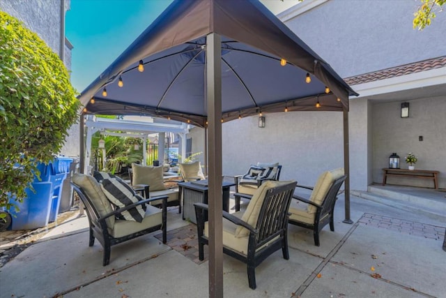 view of patio with a gazebo and an outdoor living space