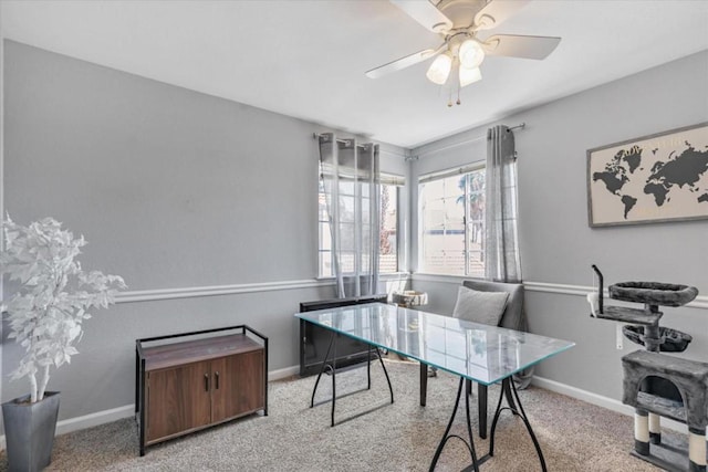 office featuring light carpet and ceiling fan